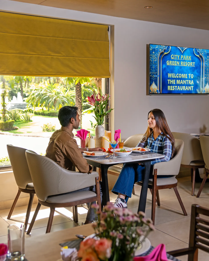 Dining space at City Park Green Resort, New Delhi