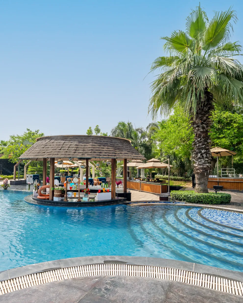 Swimming pool deck at City Park Green Resort, New Delhi